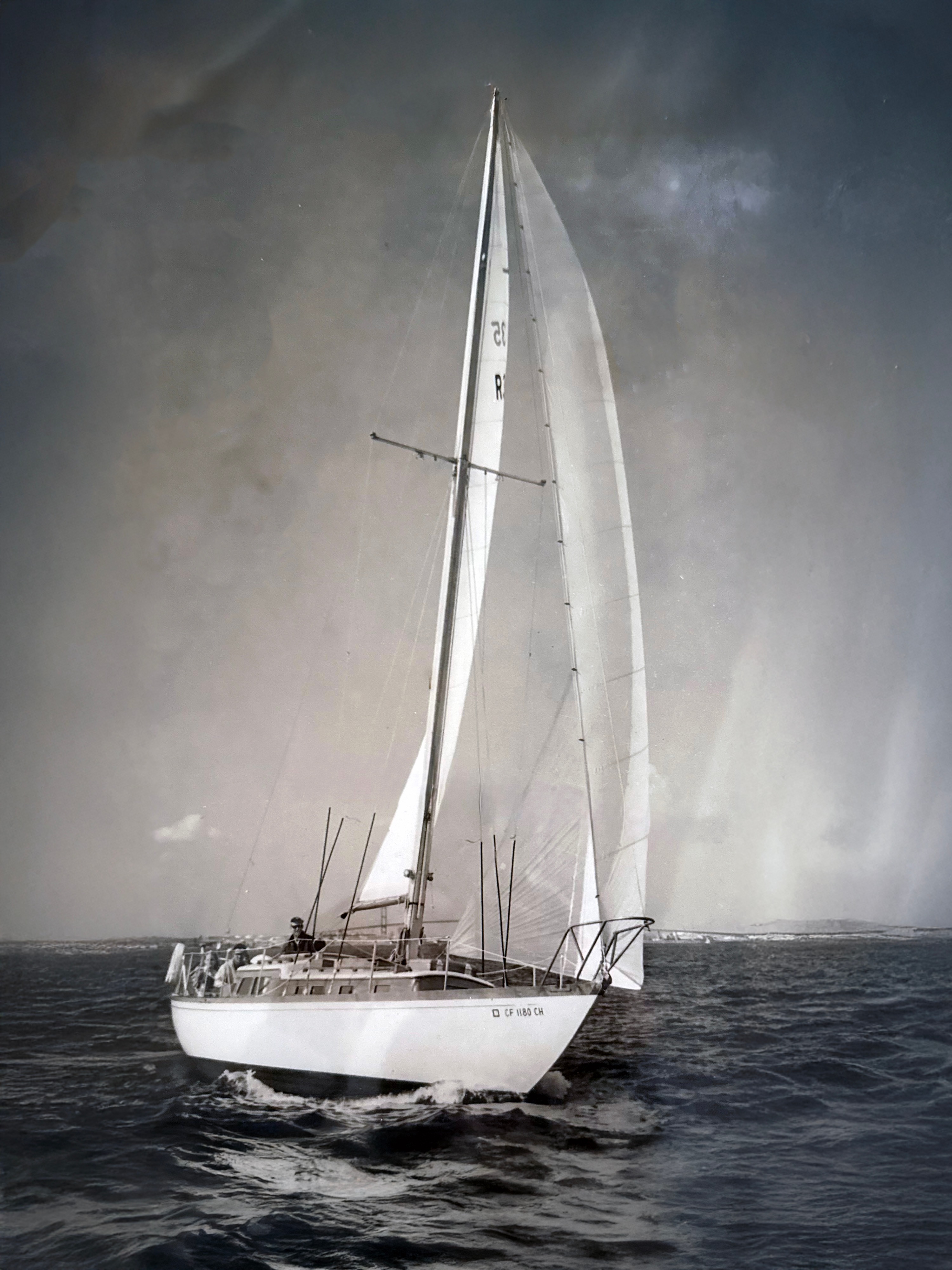 Vintage photograph of a sailboat under full sail on open waters